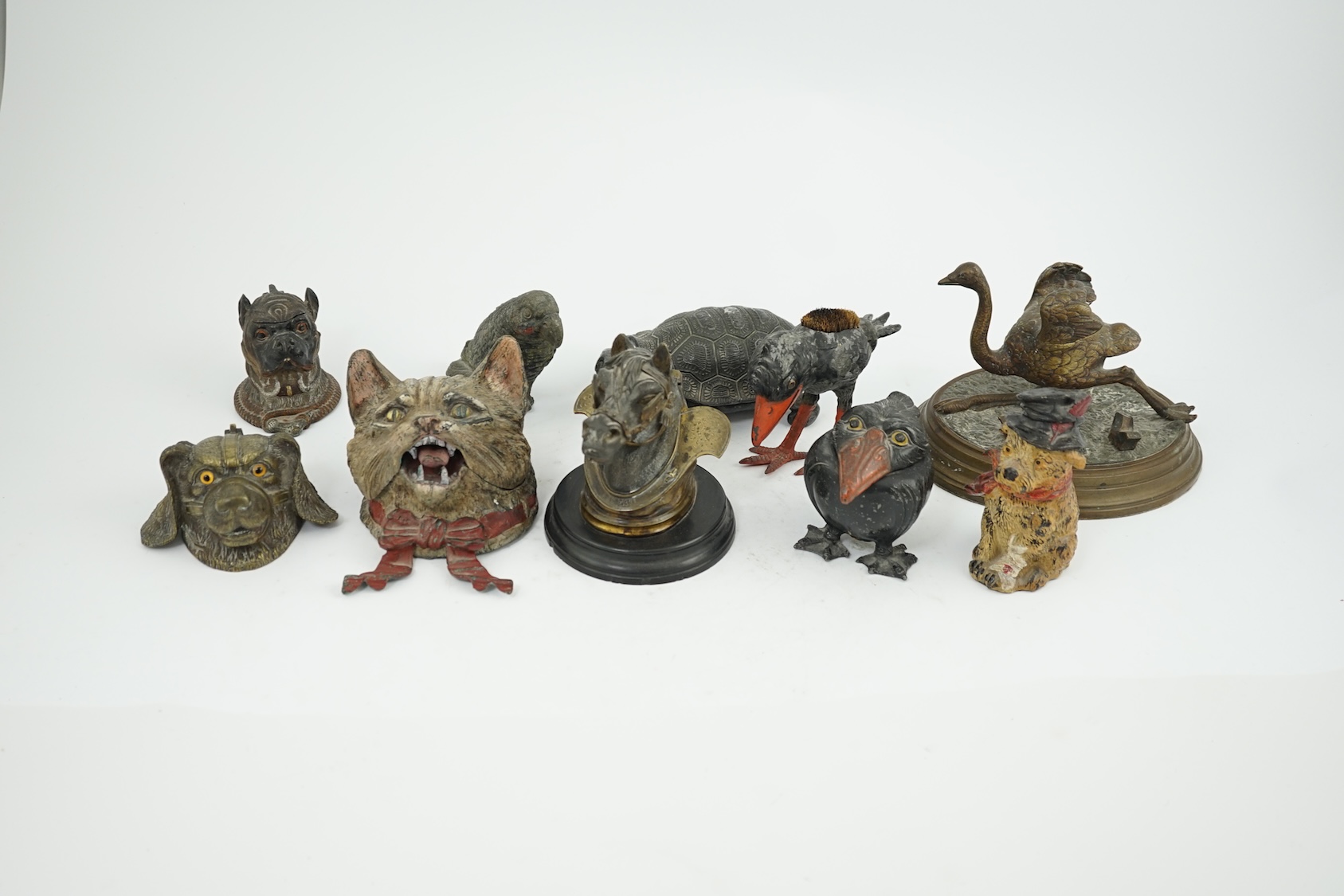 A collection ten 19th and 20th century novelty animal bronze and metal ink wells, including a Martin Brothers style ‘Wally’ inkwell